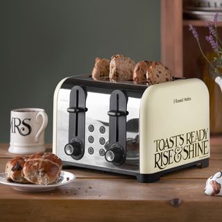 toaster and coffee mug on wooden table