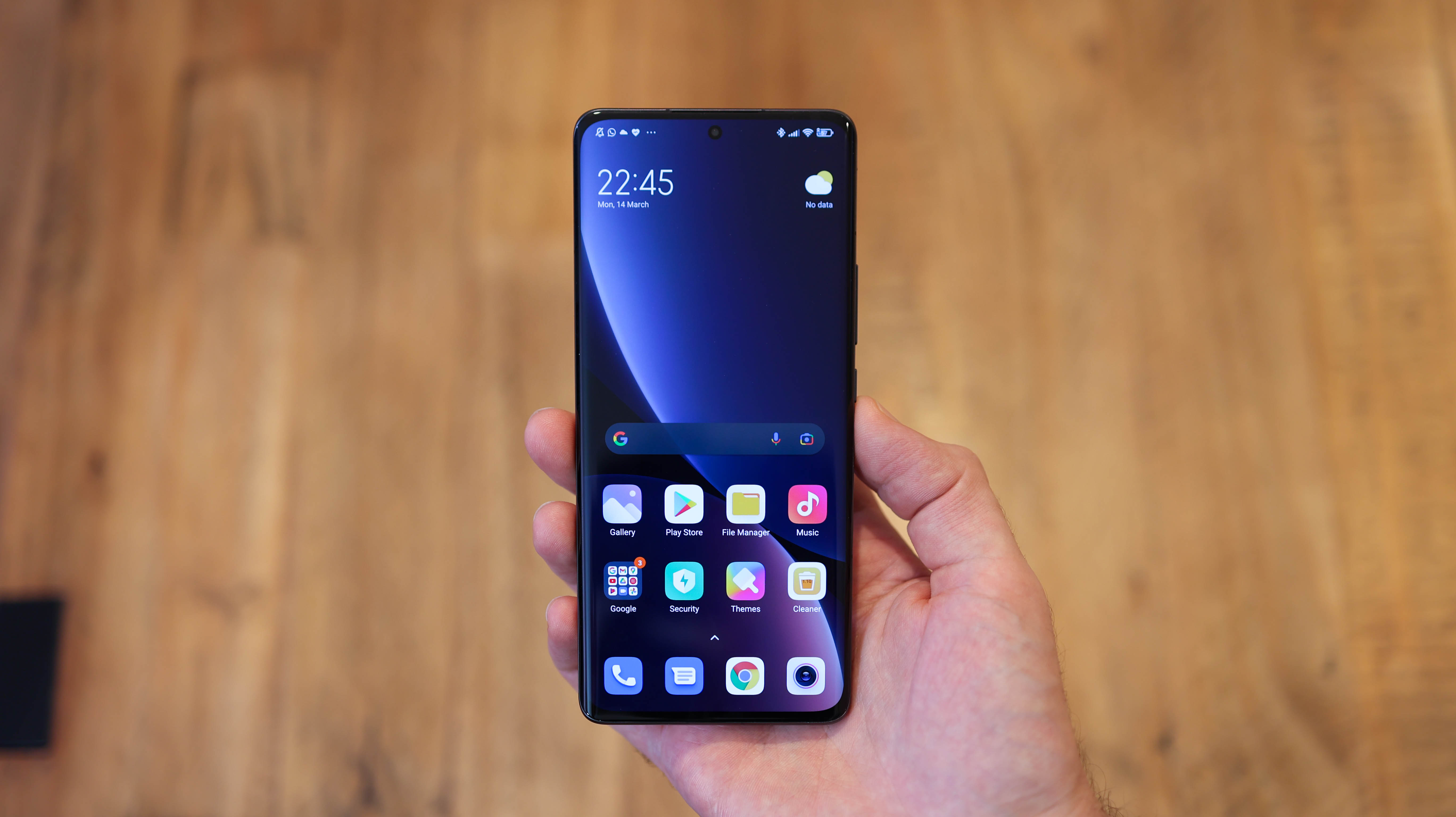 A front-facing Xiaomi 12 Pro in someone's hand