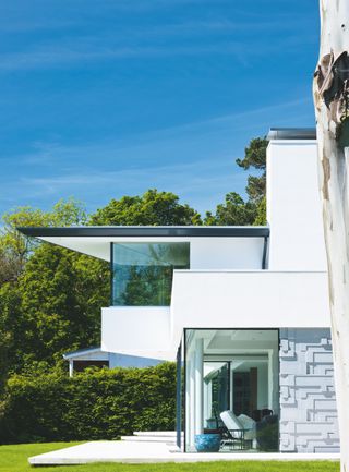 white rendered cantilevered extension to house