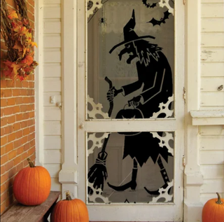 witch silhouette in a front door