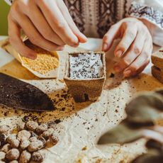 Woman using unusual seed stratification method of snow