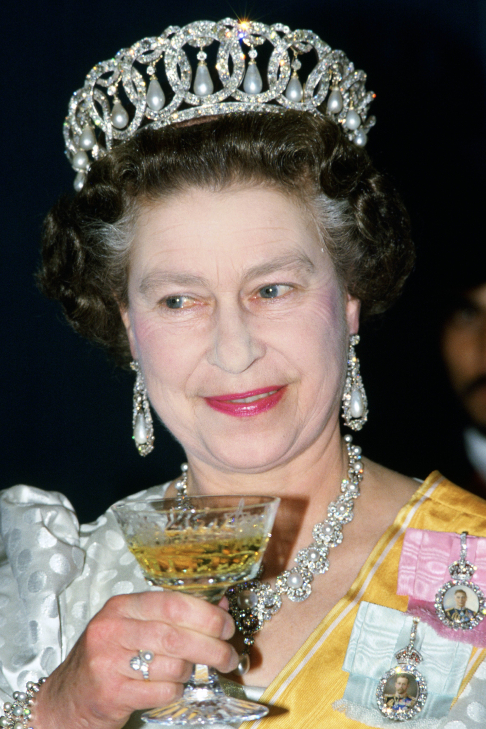 Queen Elizabeth II drinking wine