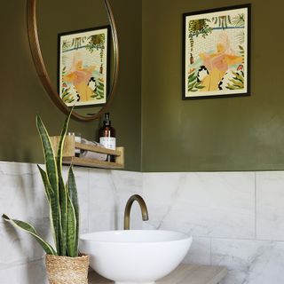 Bathroom with olive green walls and print