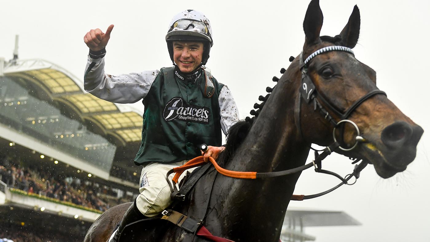 Gloucestershire , United Kingdom - 16 March 2022; Jockey Charlie Deutsch celebrates after riding L'Homme Presse to victory in the Brown Advisory Novices' Chase on day two of the Cheltenham Racing Festival at Prestbury Park in Cheltenham, England. (Photo By Seb Daly/Sportsfile via Getty Images)