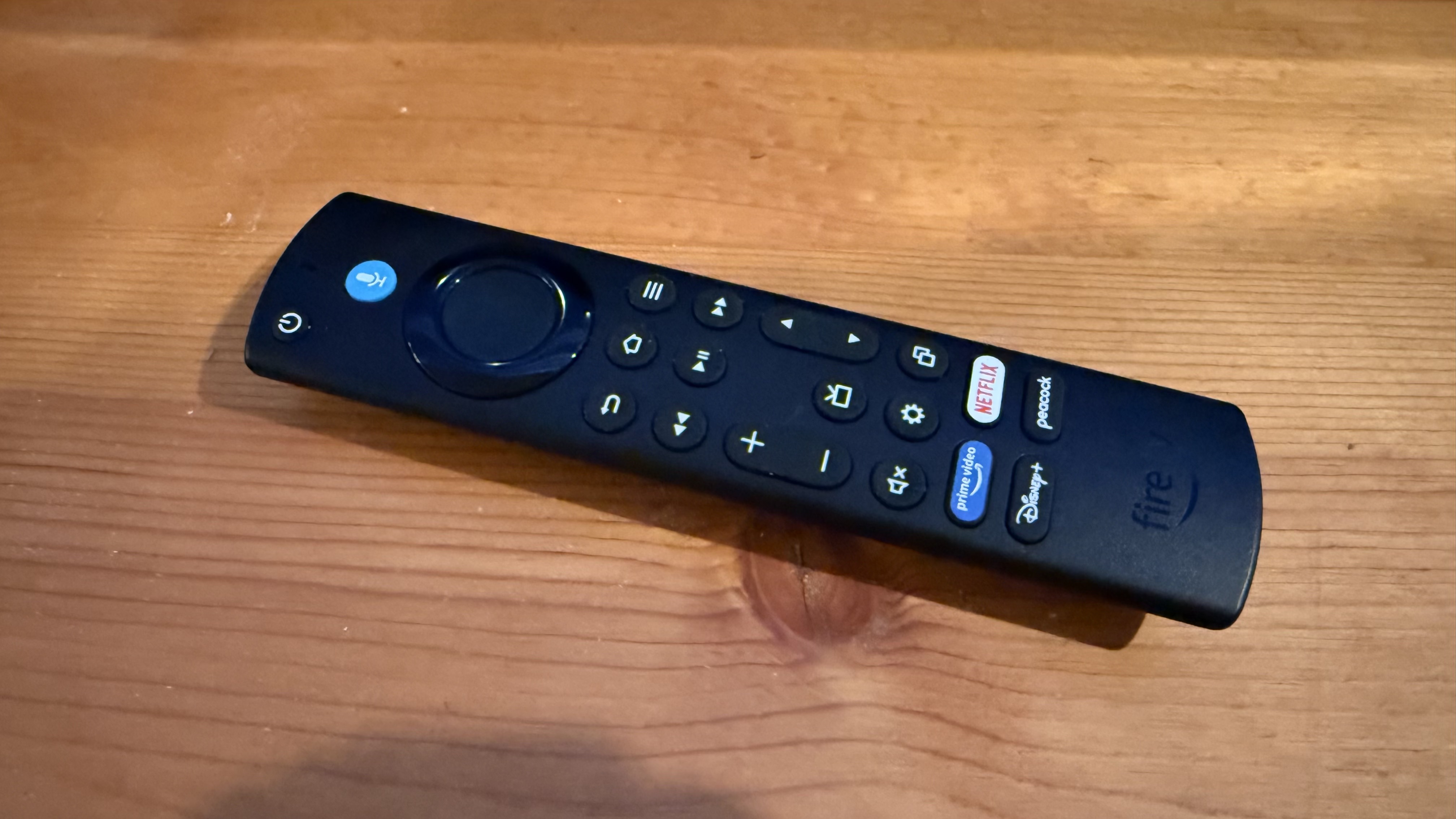 Amazon Fire TV Omni QLED (2025) remote control on table
