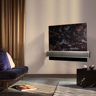 cream wall with curtain and music system on tv screen