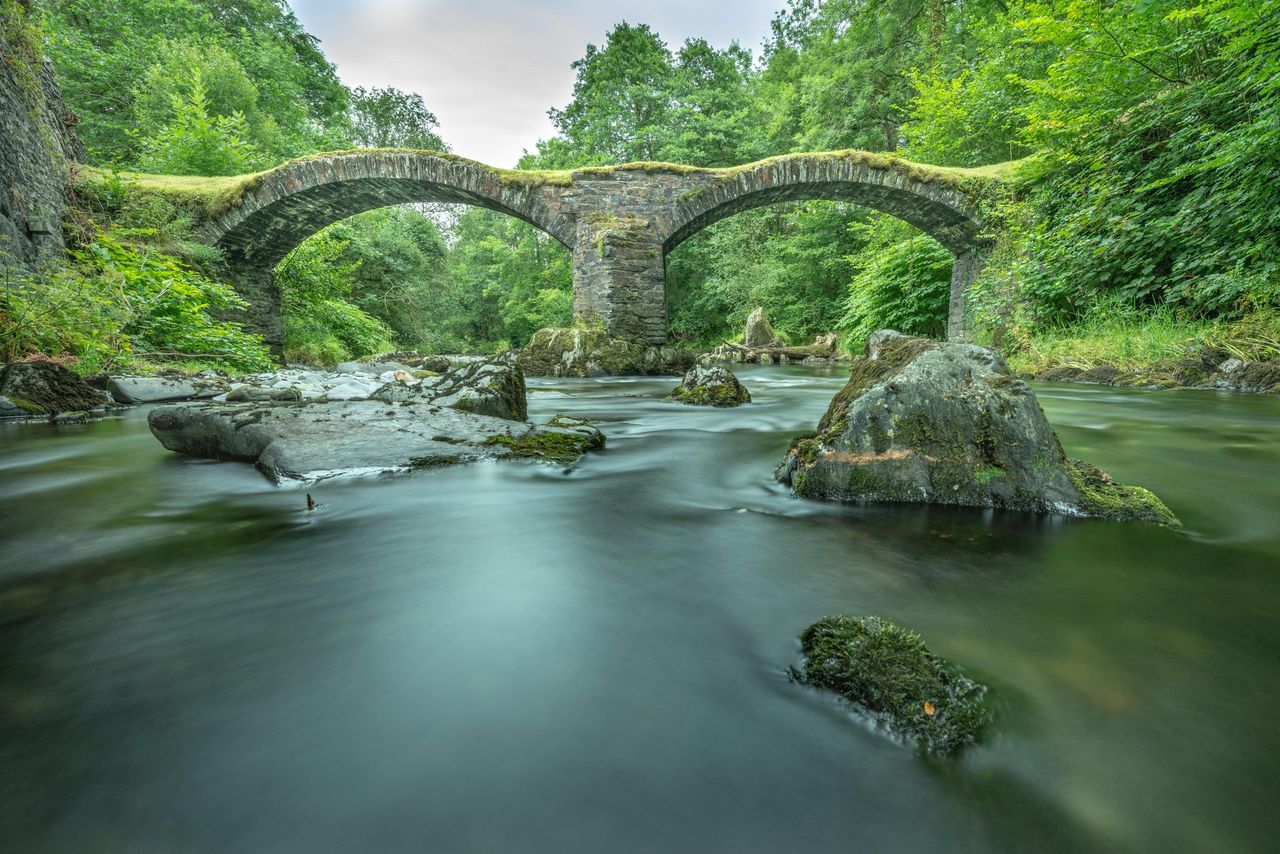 Pont Minllyn, the 17th century bridge built for pack horses crossing the River Dovey at Dinas Mawddwy.