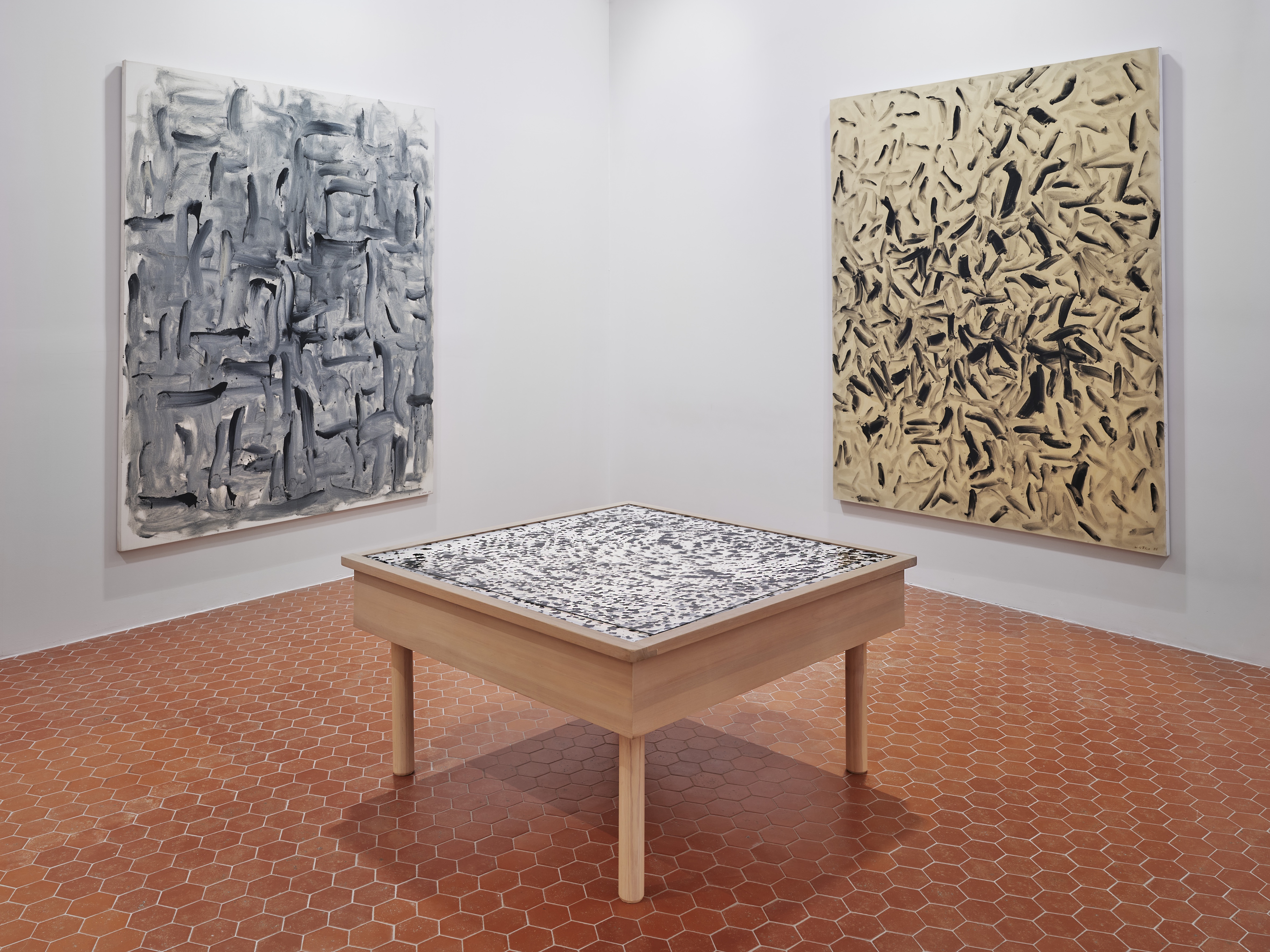 Installation view of an abstract painting showcase in a gallery.