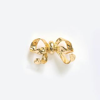 gold bow-shaped jewellery by Self-Portrait