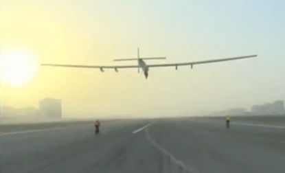 The Solar Impulse plane takes off.