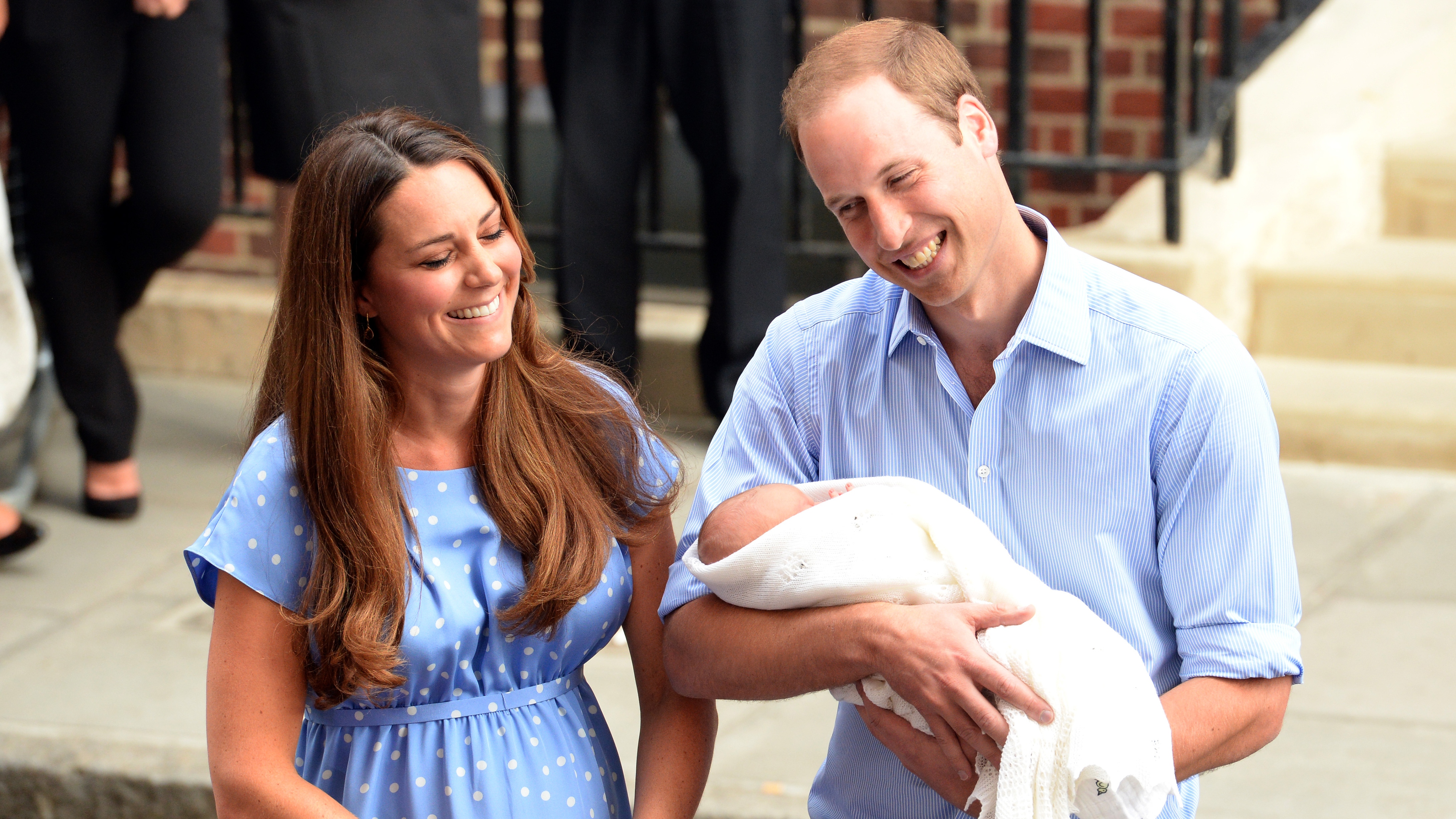 Catherine, Princess of Wales, and Prince William, who is holding their newborn son Prince George, depart the Lindo Wing of St Mary's Hospital on July 23, 2013