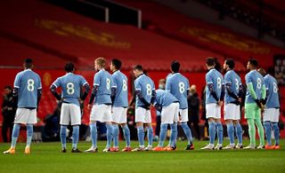 Manchester City players line up in retro number eight shirts in memory of Colin Bell