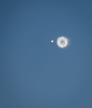 Smoke Ring Follows Receding Antares Rocket After Launch