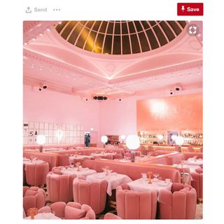 restaurant with pink walls and golden domed ceiling