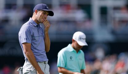 Jordan Spieth puts his hand to his mouth after missing a putt