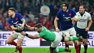 France's Matthieu Jalibert evades a tackle from Ireland's Peter O'Mahony