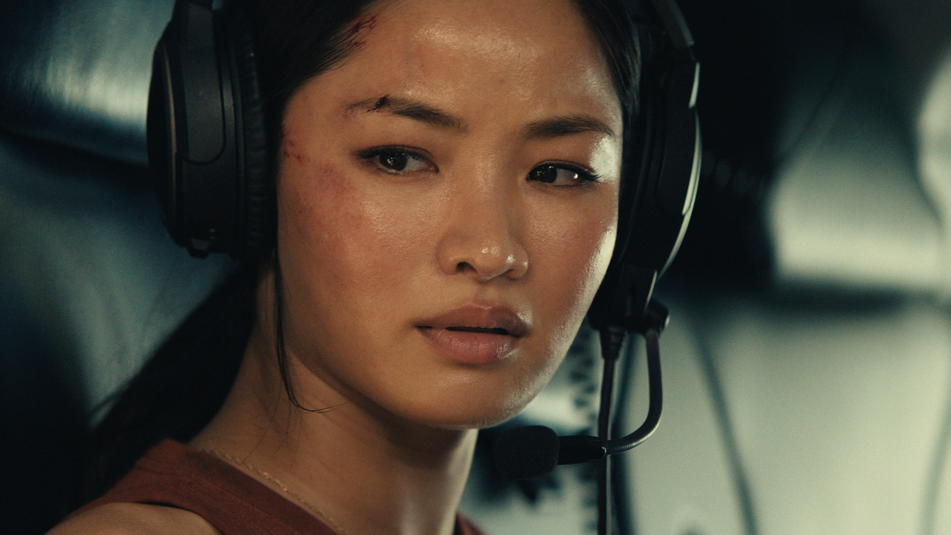 A close up of Cate wearing a headset in a helicopter in Monarch: Legacy of Monsters season 2 episode 9