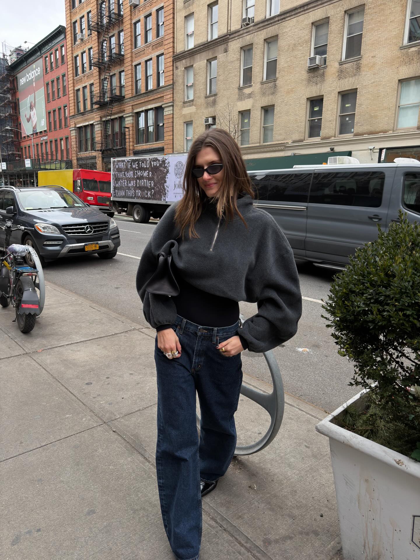 Influencer wearing a half-zip pullover and jeans