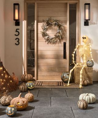 modern home front porch for pumpkin lantern decor and a light up skeleton