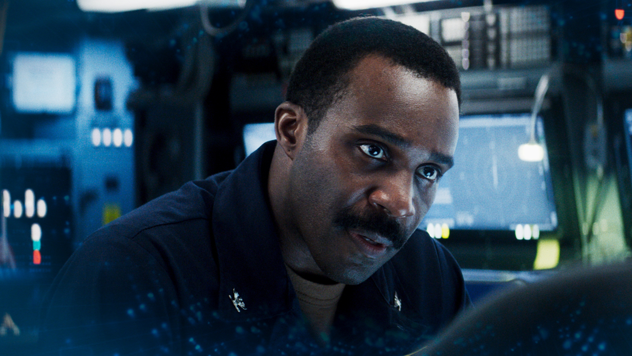 Tramell Tillman leans forward with a look of urgency in Mission: Impossible - The Final Reckoning.