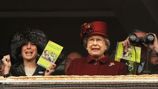 Queen Elizabeth II watches a race on Gold Cup day at the Cheltenham Festival on March 13, 2009