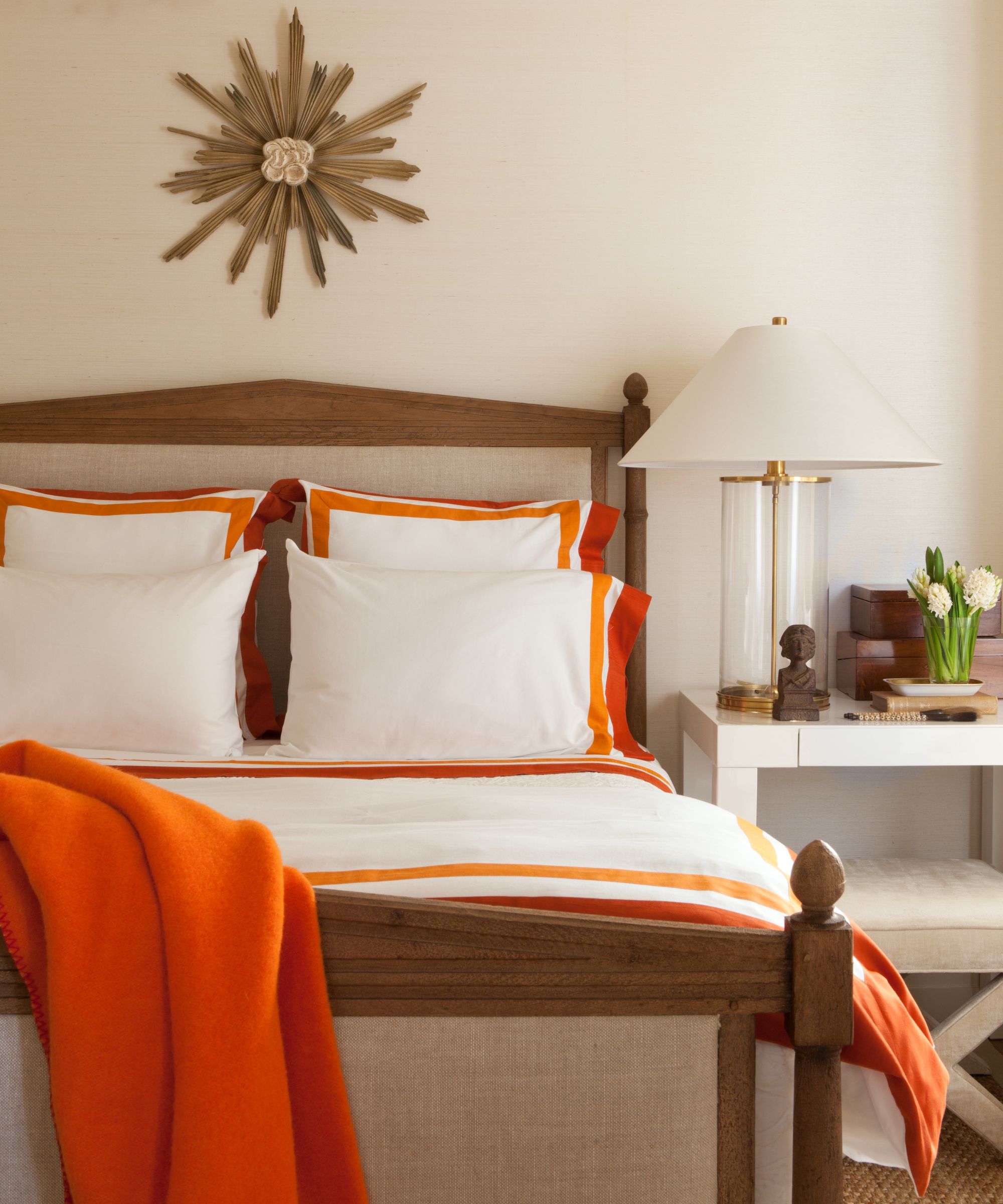 bedroom with orange edged sheets