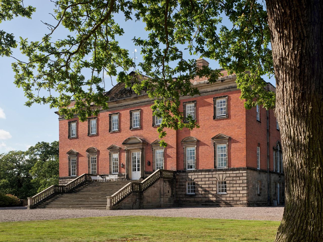 Fig 1: The main front of the house is approached up a broad flight of steps. Radbourne House. ©Paul Highnam / Country Life