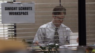 Dwight through a window in The Office