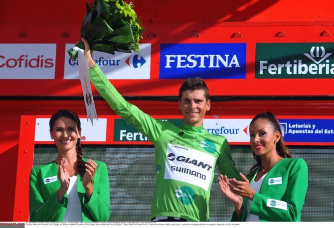 Warren Barguil (Giant-Shimano) accepts the green jersey for teammate John Dgenkolb