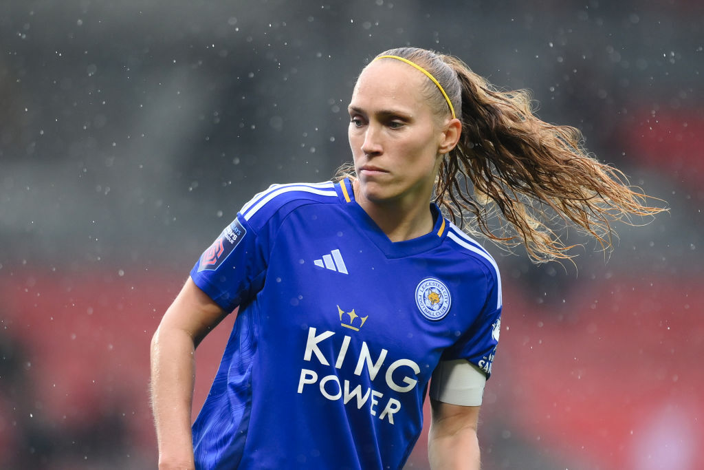 Janice Cayman on the pitch in the rain