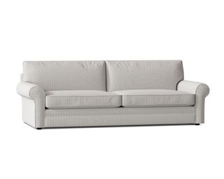 A grey-striped queen sleeper sofa with scroll arms