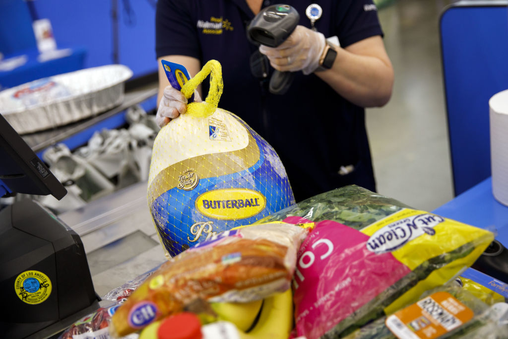 Cashier ringing up groceries for a customer