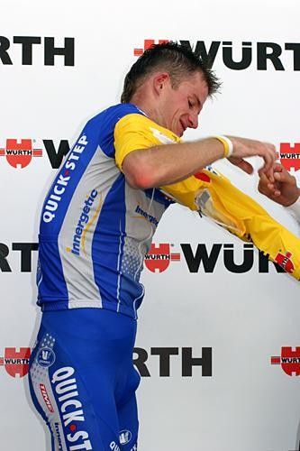 Sometimes putting on the yellow jersey is the hardest thing at the end of a mountain stage.