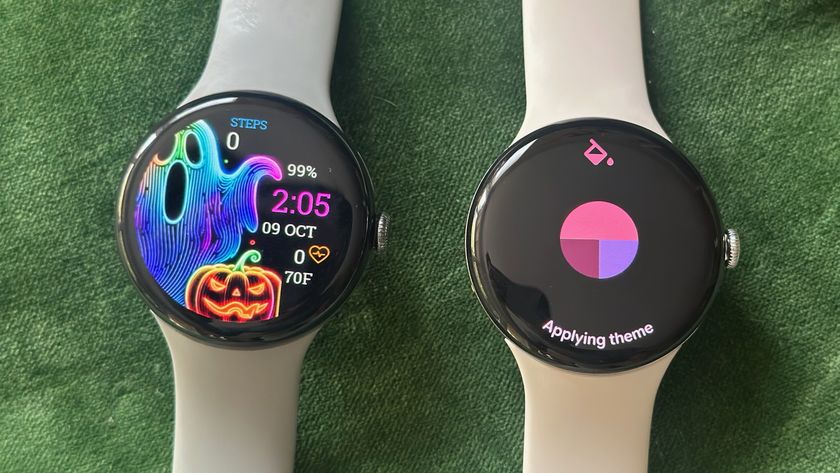 The Pixel Watch 3 (left) and Pixel Watch 4 (right) sitting on a green pillow. The Watch 3 shows a custom Halloween-themed watch face; the Watch 4 shows an &quot;Applying theme&quot; screen pulling red, maroon, and purple colors from a watch face.