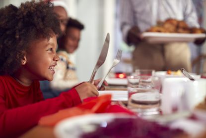 Mince pie shortage Christmas 2021 - little girl waiting for Christmas dinner