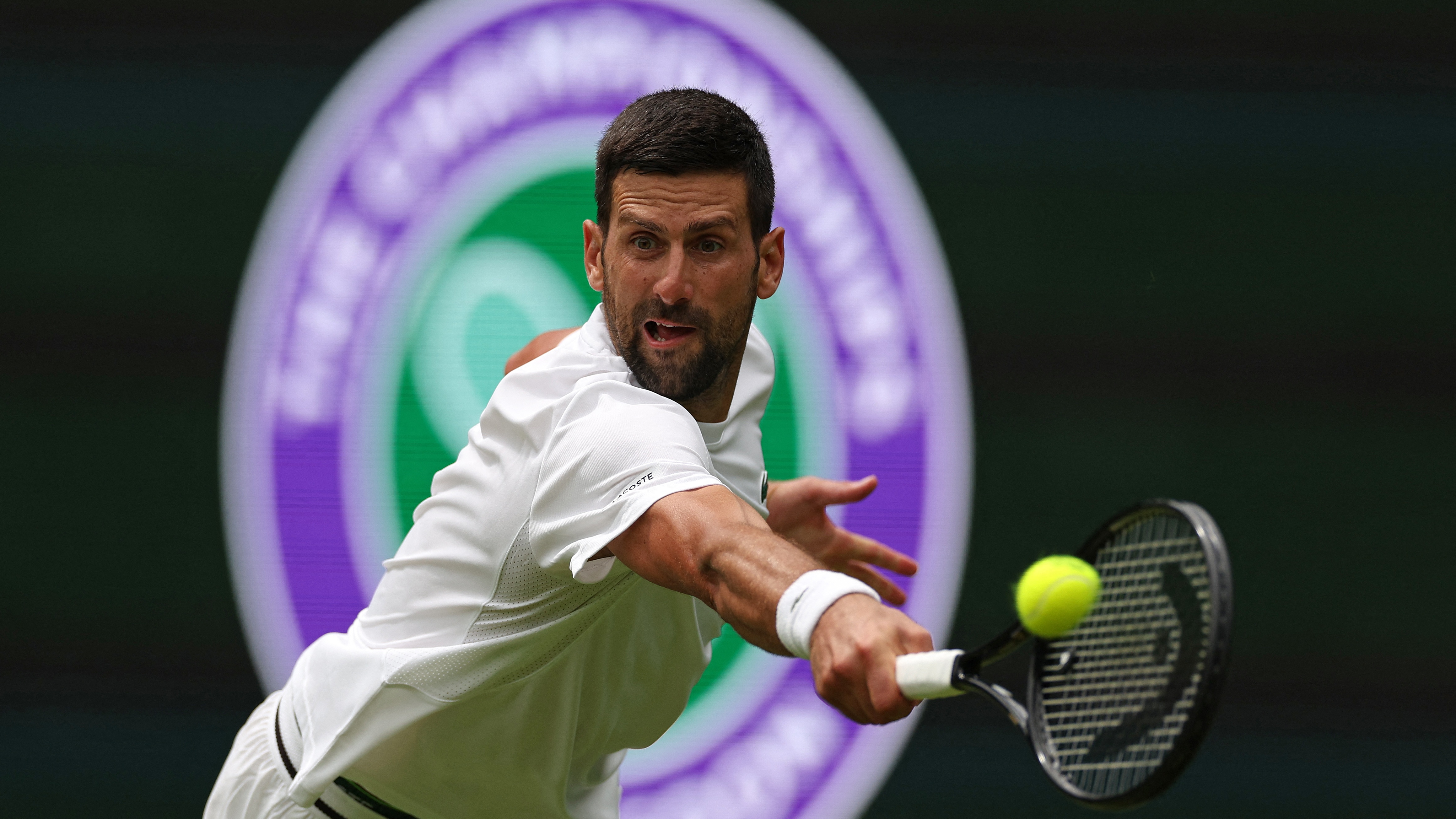 Serbia's Novak Djokovic practices with Italy's Jannik Sinner on No. 1 Court at The All England Lawn Tennis Club in Wimbledon ahead of the 2026 Wimbledon Championships. 