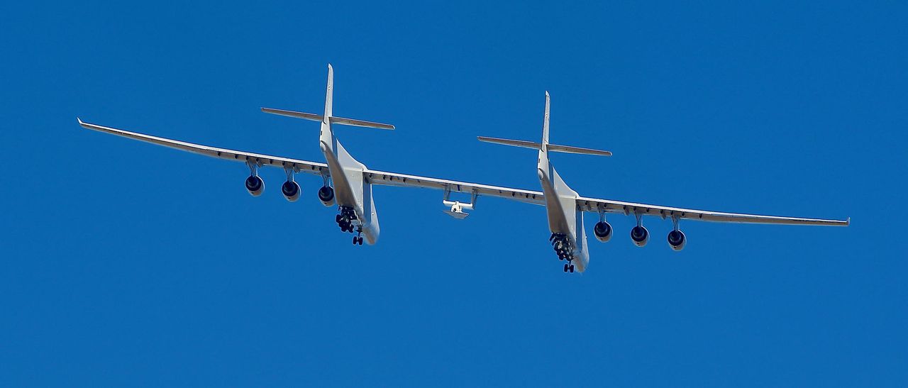 Stratolaunch's giant carrier plane Roc and its Talon-A testbed takes off from the Mojave Air and Space Port in Mojave, California on the company's first captive carry test on Oct. 28, 2022.