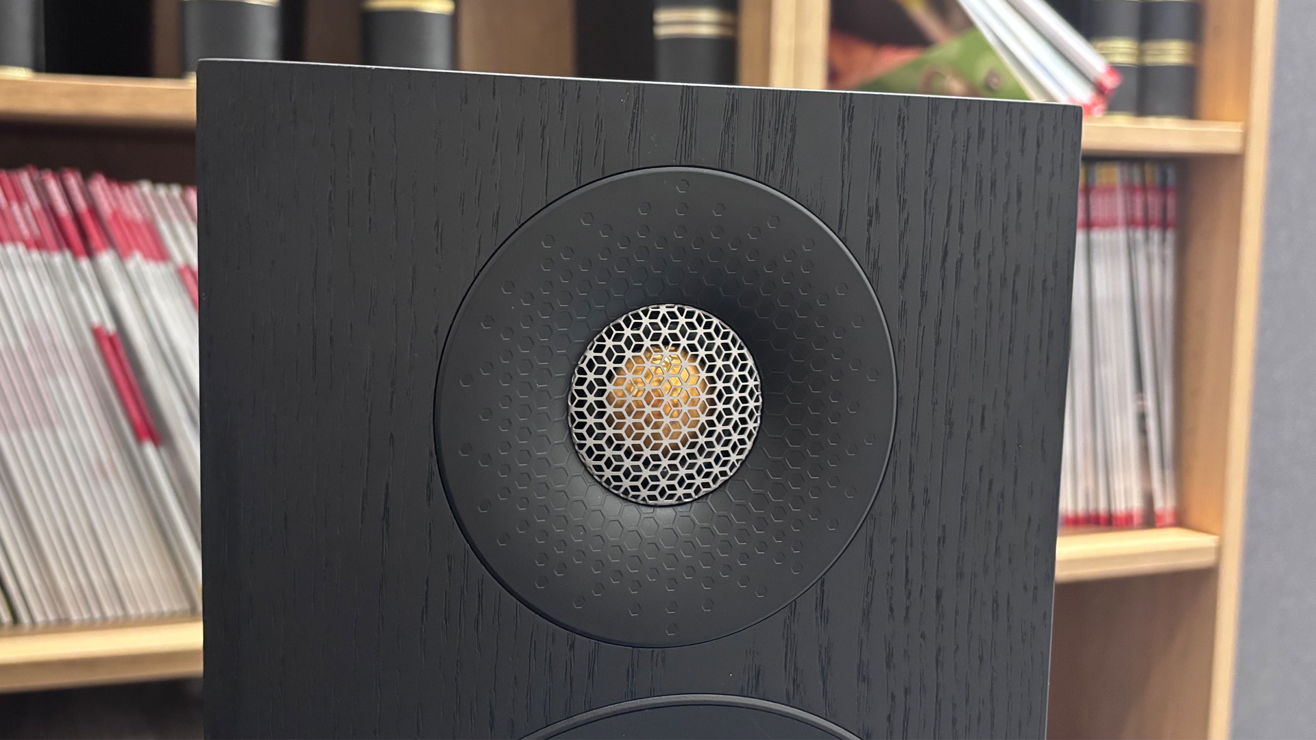 Monitor Audio Bronze 300 7G floorstanding speaker in front of bookcase detail of tweeter