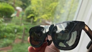 A pair of Xreal One smart glasses outfitted with an Xreal Eye camera and a set of HonsVR prescription lenses