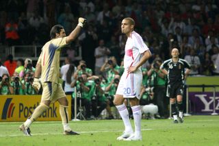 France forward David Trezeguet looks dejected after missing a penalty in the 2006 World Cup final shootout as Italy goalkeeper Gianluigi Buffon celebrates.