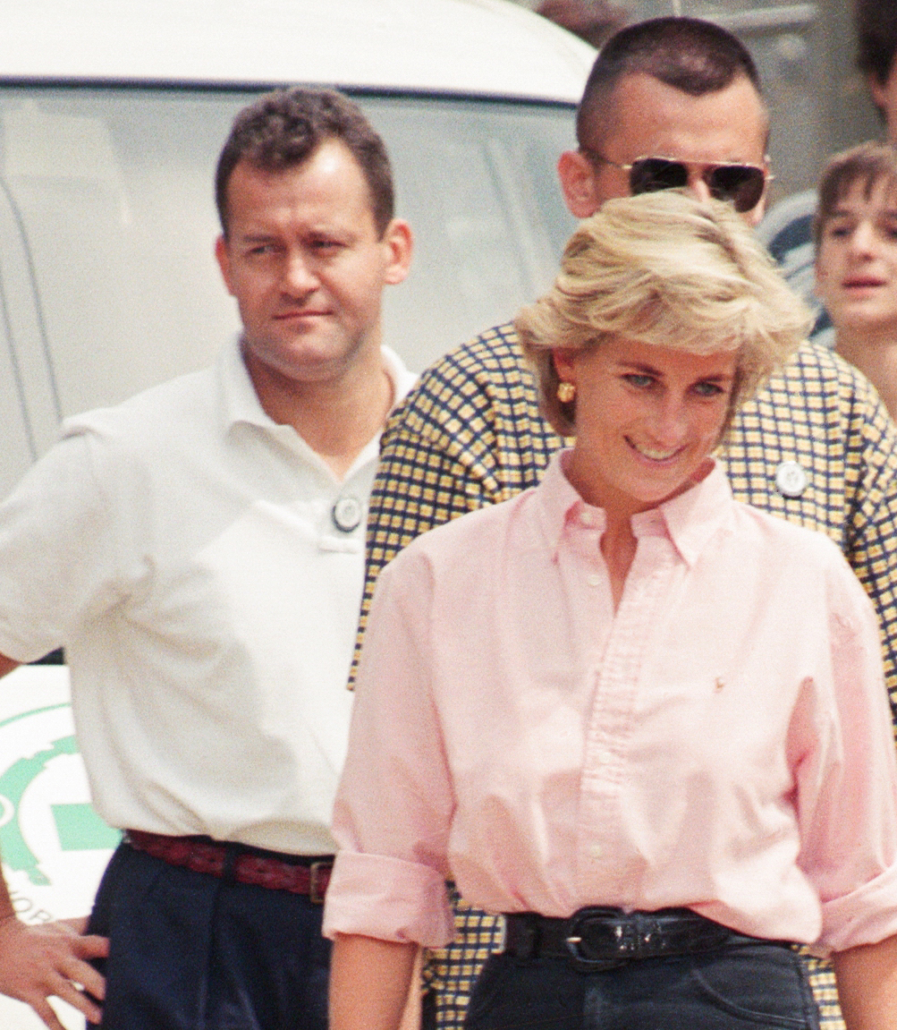Princess Diana wearing a pink button up shirt
