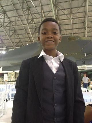 Seventh-grader Lamir Brewster, who aspires to be a pilot, attended the Shades of Blue gala on Aug. 31, 2015, at Denver's Wings Over the Rockies Air & Space Museum in Denver.