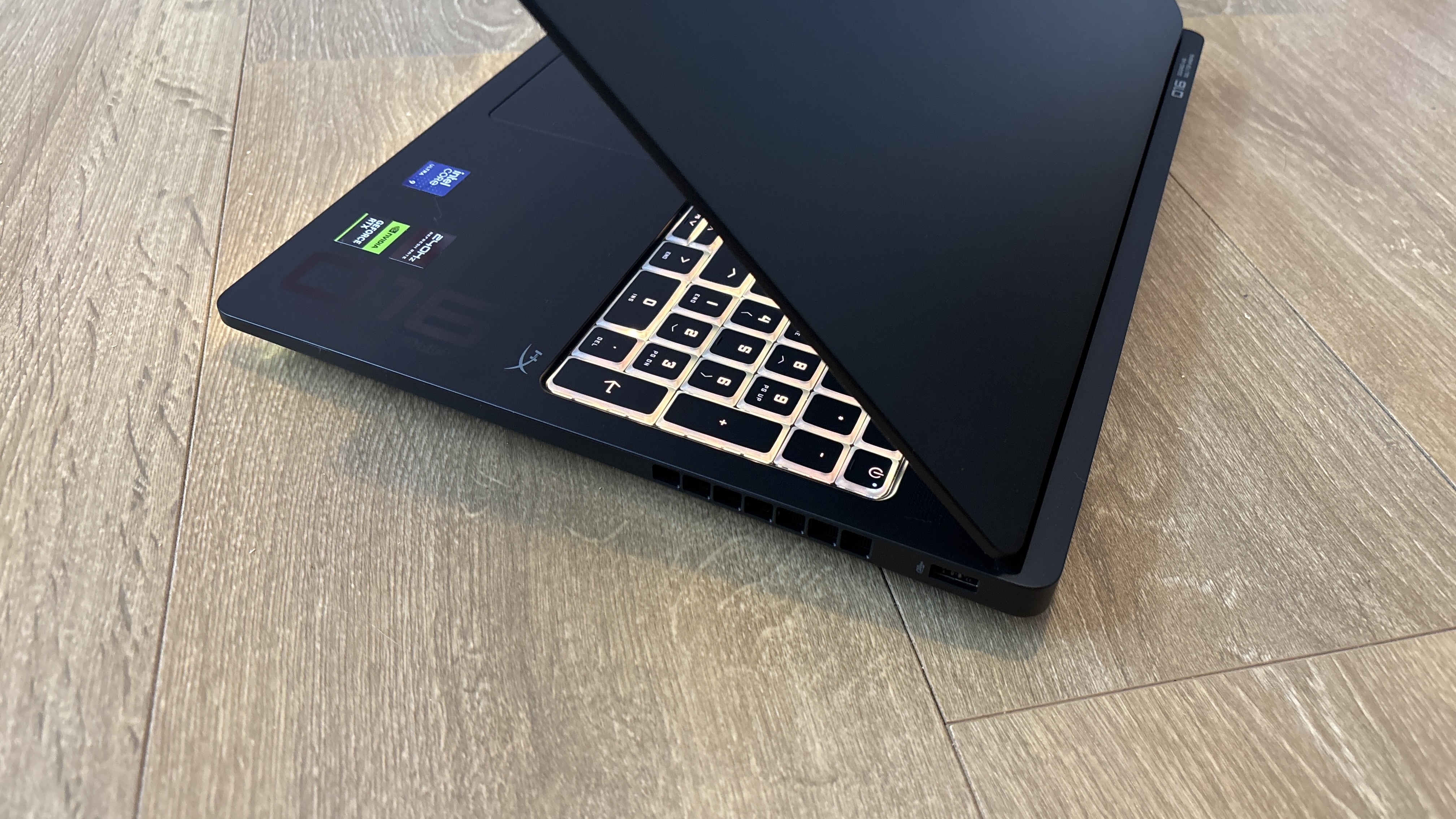 HP Omen Max 16 gaming laptop on wooden surface