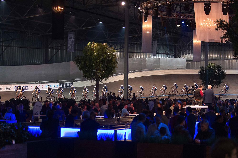 Fans watch Etixx-QuickStep round the Eddy Merckx velodrome at the team presentation.