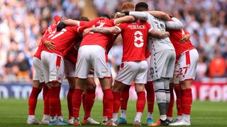 The Nottingham Forest players in a huddle during their Sky Bet Championship Play-Off with Huddersfield Town at Wembley Stadium on May 29, 2022.