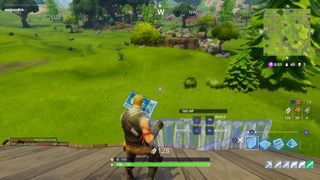 Games like Minecraft - a player looking at their map during Fortnite