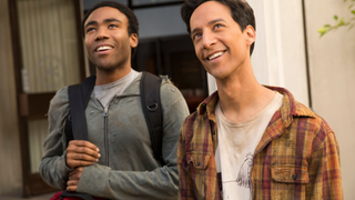 donald glover and danny pudi smiling and looking upwards on community