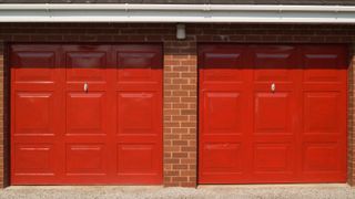 Front on shot of two red up and over panelled red garage doors