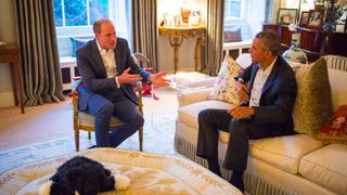Prince William, Duke of Cambridge speaks with US President Barack Obama