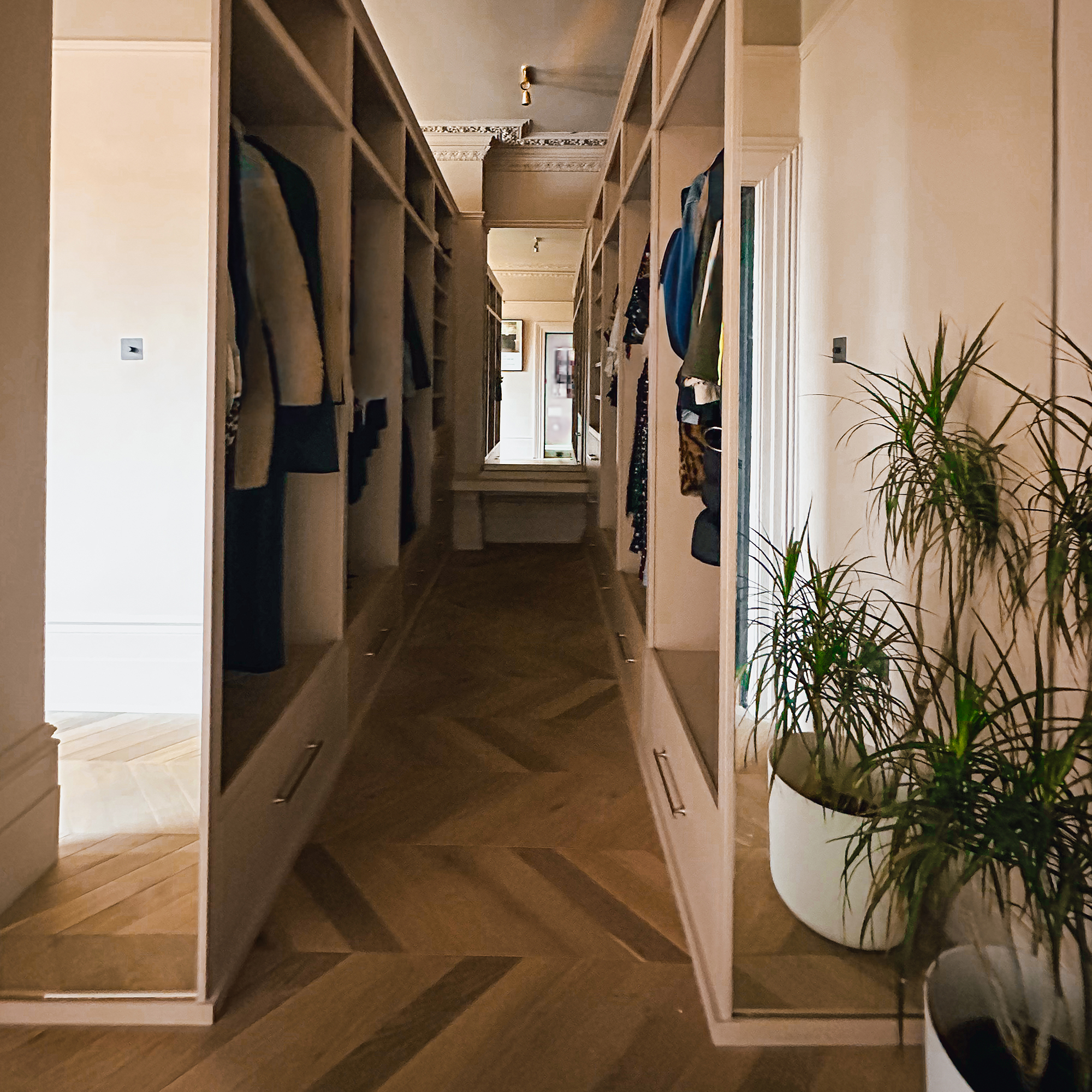 bedroom wardrobes installed with a central corridor